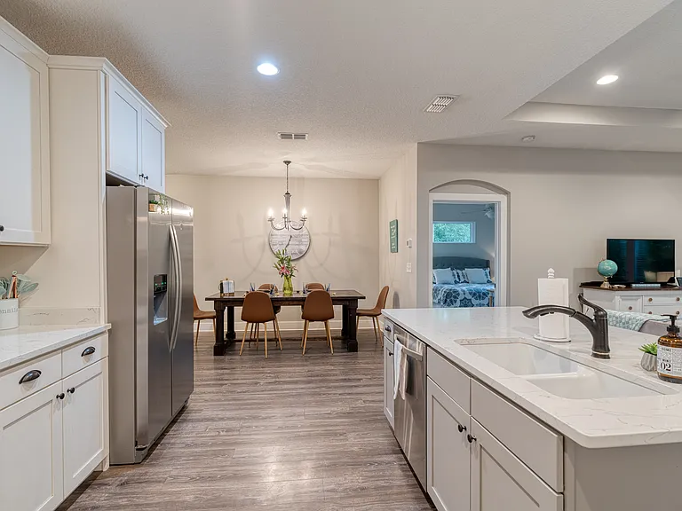 Enjoy a seamless transition between cooking, dining, and relaxing in a beautifully designed, cohesive space