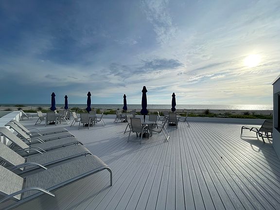 View from BVG deck and recreation area perfect for evening "sun downers" and socializing with neighbors and friends on the beach and near the pool/Clubhouse