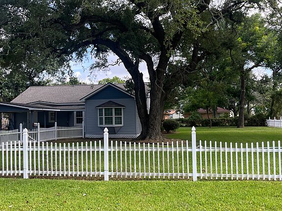 A great picture of the oversized lot, bug enough for a swing set, gardens and an outdoor BBQ area.