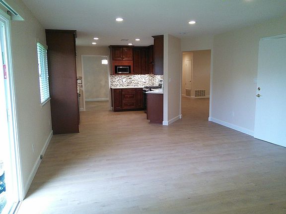 Family room, with the view of the kitchen.