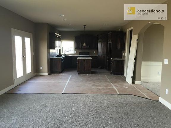 Hardwoods are under the protection layer until completion.