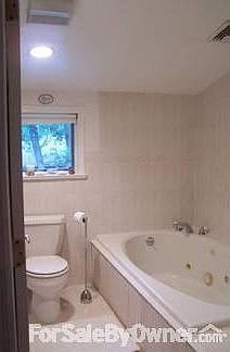 Upstairs bath : Large bathroom with jacuzzi tub and stand up shower.