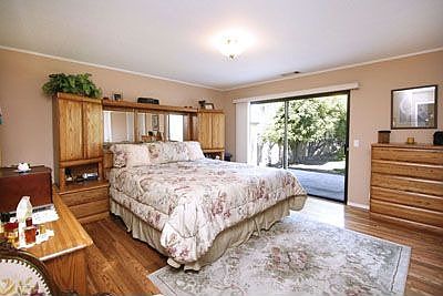 Master bedroom with access to private patio.