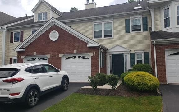 Front of house - space to park two cars in driveway