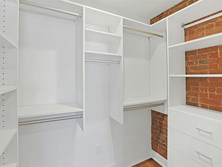 Large walk-in closet offers amazing storage.