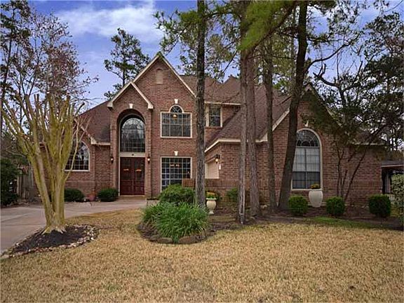 Beautifully appointed home with professional landscaping and naturally wooded lot.