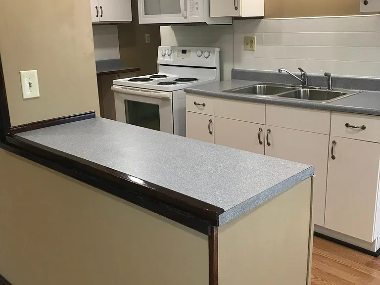 Eat in Kitchen counter with two bar stools.