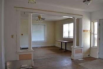 Large living room area with a lot of character.