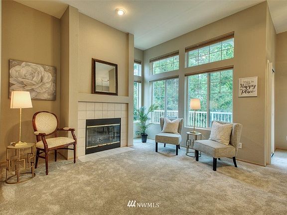 Love this living room with floor to ceiling windows!