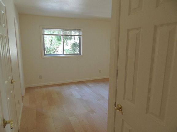 Master bedroom with linen closet on the right and walk-in closet on the left.