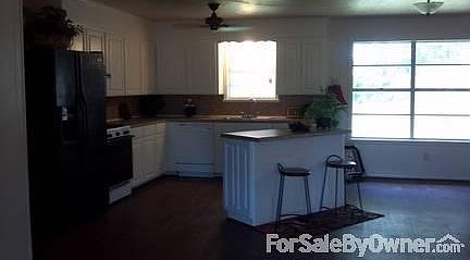 kitchen w/island
						:
						open, solid wood cabinets with new doors, ref, gas stove, 2 yr dishwasher, fan