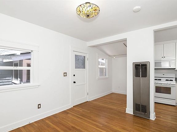 Front door shown. Walk in to the right is the living room, to the left is the eat-in kitchen.