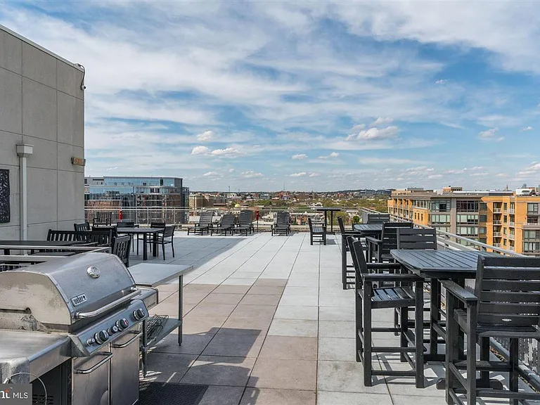 Rooftop deck with grills & plenty of seating.