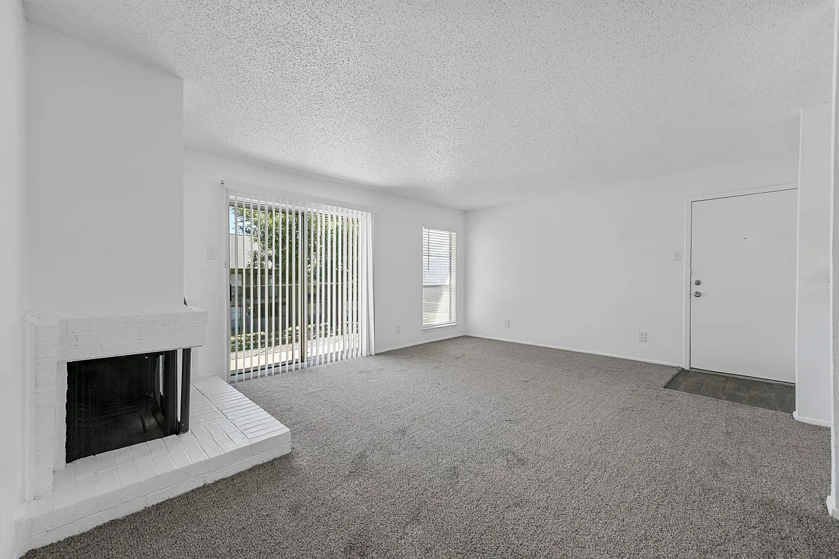 Spacious open floor plan with access to kitchen and fireplace with sliding door - Stone Canyon