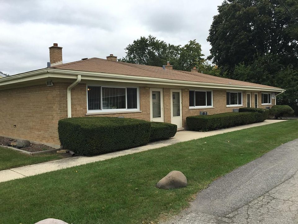 Brick building with new windows on quiet cul de sac adjacent