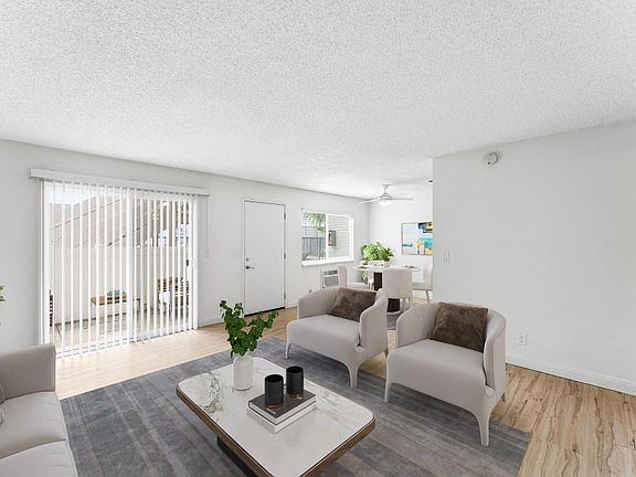 Livingroom with slider doors lead to private patio.