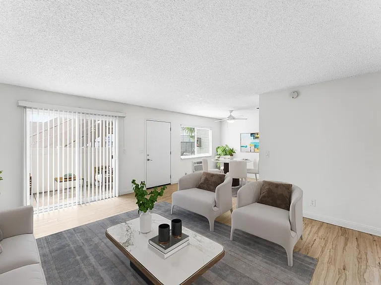Livingroom with slider doors lead to private patio.