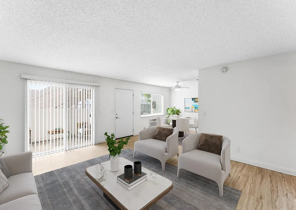 Livingroom with slider doors lead to private patio.
