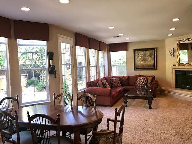 Family room with windows opening to backyard