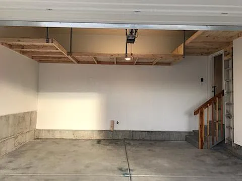 Double garage with suspended storage