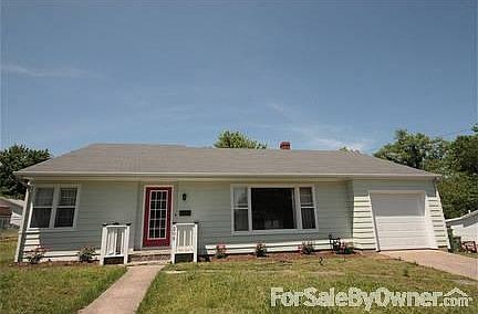 View from street
						:
						New paint, new front door, new garage door. New knock out roses landscaping.