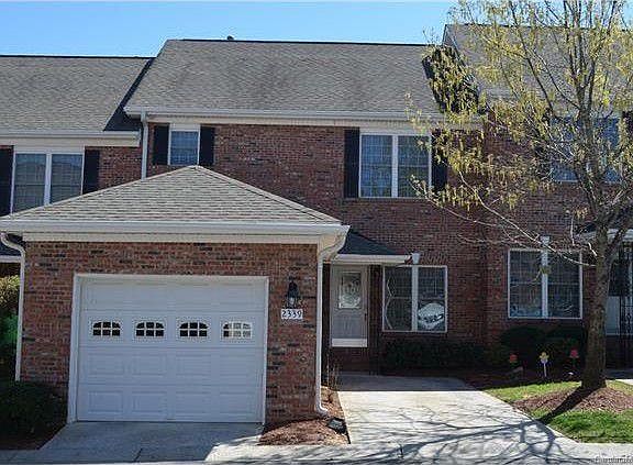Brick townhome with 1 car garage and dedicated driveway