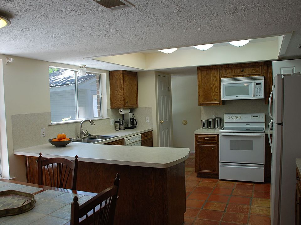 Lovely views of yard and pool from this light and bright kitchen.