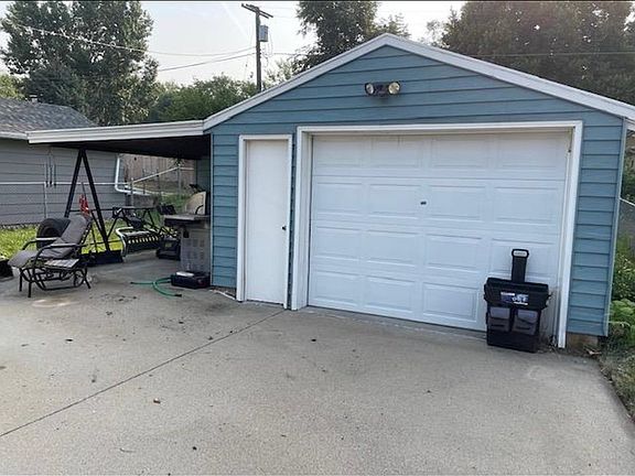 Detached garage, carport and grilling pad