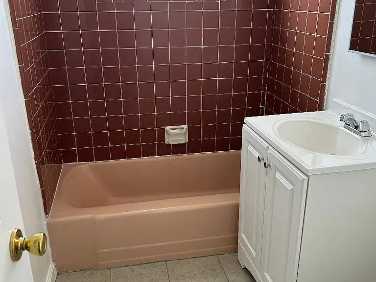 bathroom with brand new vanity and brand new tile floor