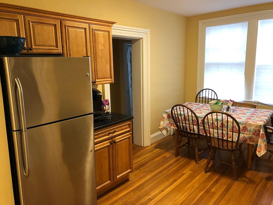 Eat in kitchen with stainless appliances and granite counters