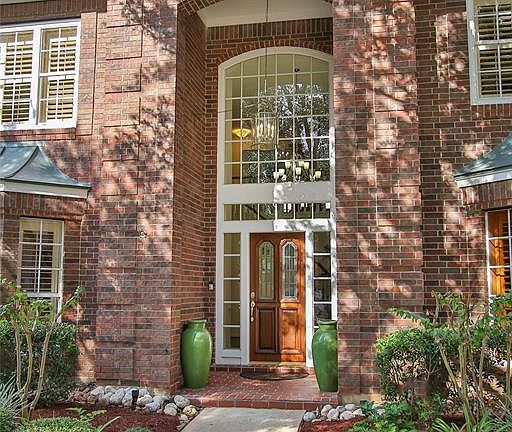 This impressive double height entrance floods the home with light.