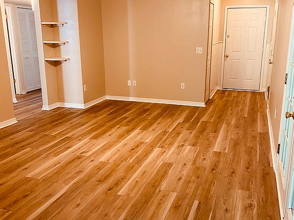 Large family room with ceiling fan.