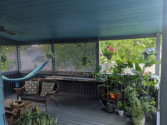 Rear shared porch filled with plants