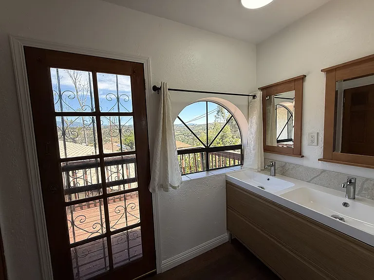 Upstairs En-Suite Primary Bathroom-New Double Sink Vanity & Fixtures/Access Door to Balcony