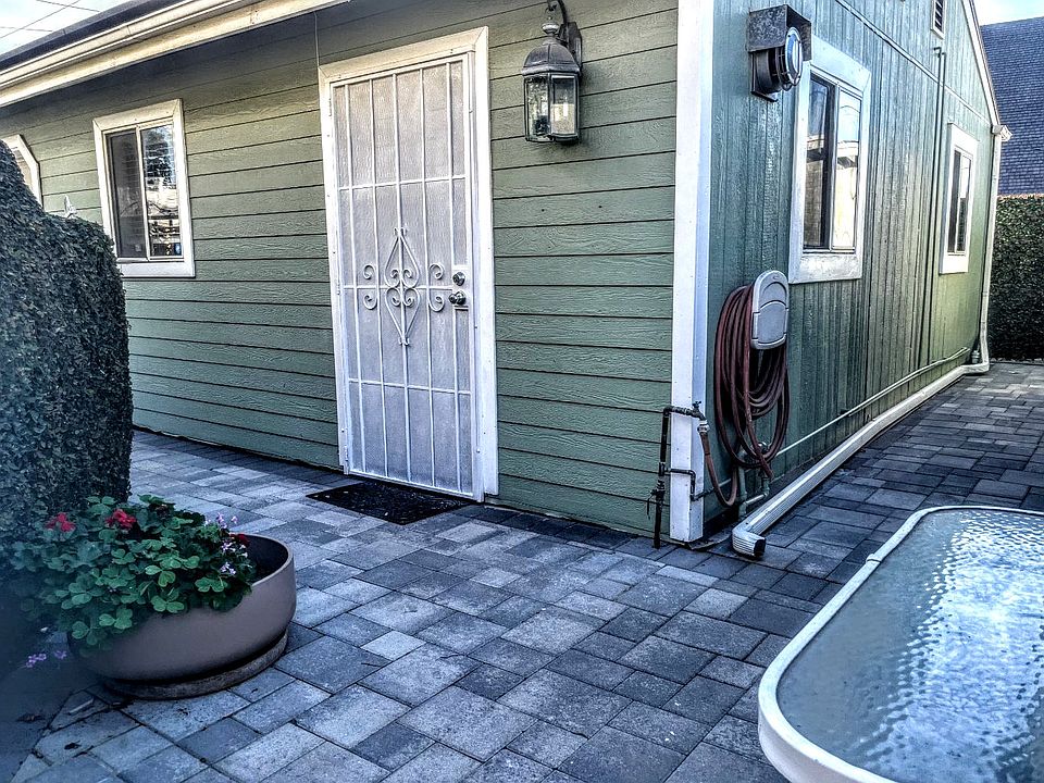 Patio in front of studio. Studio is attached to garage and detached from main house