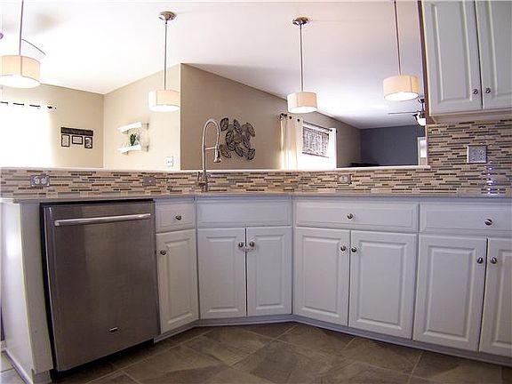 Marble/travertine/glass tile and great lighting