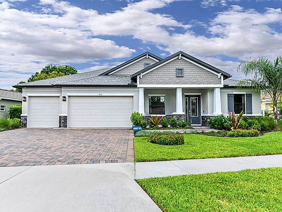 Joyce craftsman elevation with opt stone La Paloma model home William Ryan Homes Tampa
