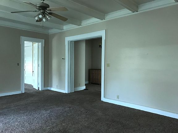 Living room looking into hallway and bedroom