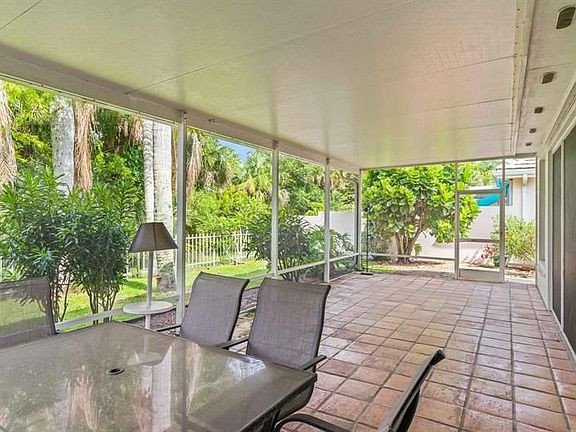 4th image of 7744 SE Needle Palm Cir