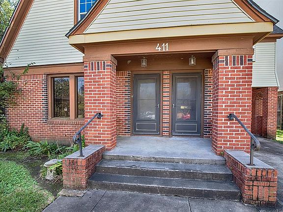 The entry to the first floor is on the left. The door to the right has access to the top floor.