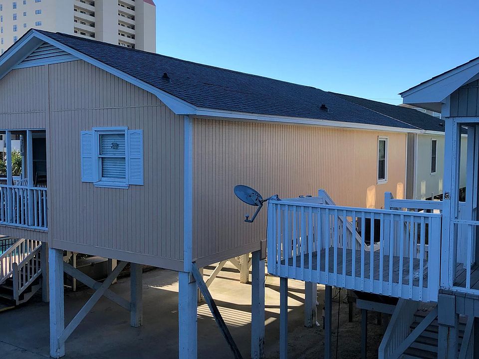 SeaLaVie house with new roof. G house beside pool.