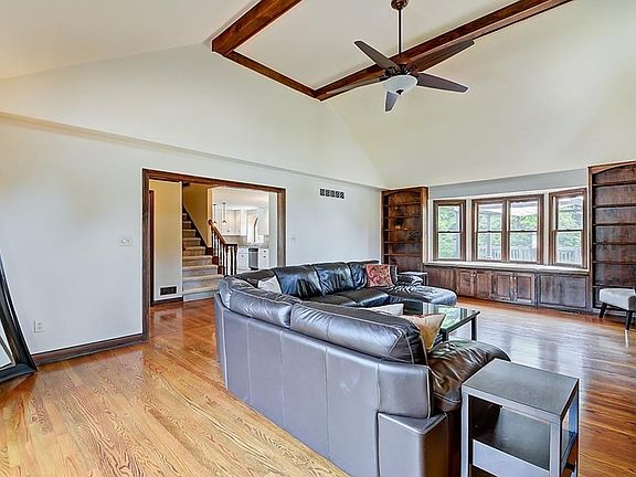 Great Room with built-in shelving and abundant natural light.