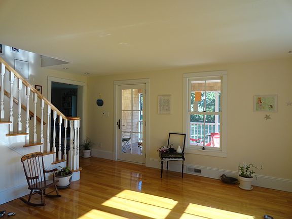 Stairway between kitchen and livingroom and front porch