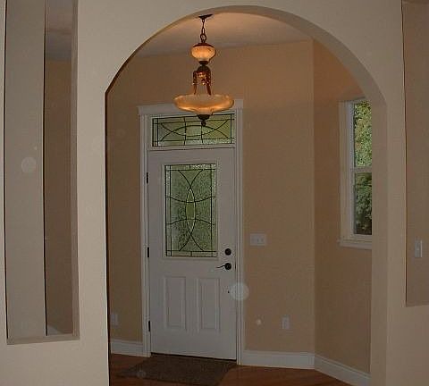 Entry w'/ Leaded Glass Door and Carved Alabaster Light Fixture