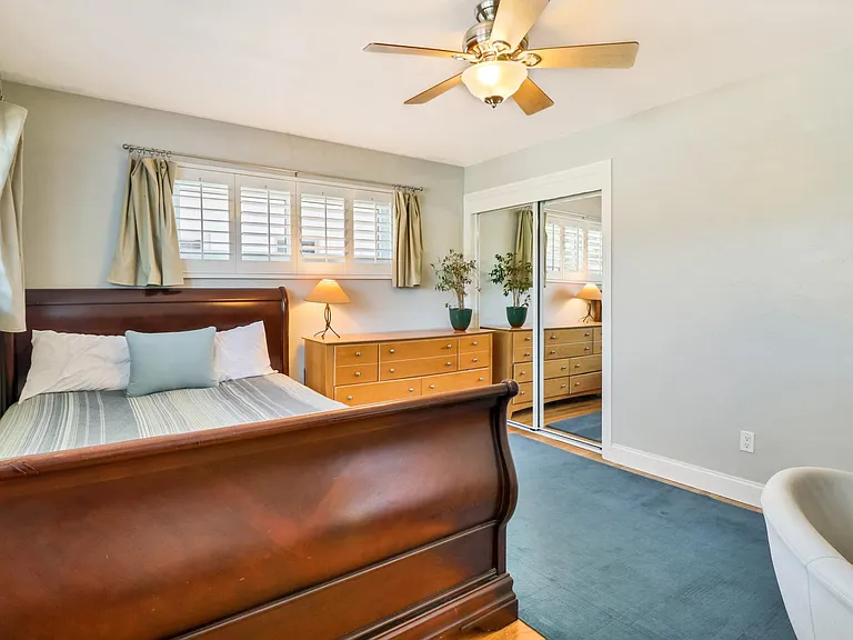 Second Bedroom has lots of light and space (queen bed is pictured).