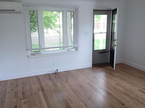 Living room with hardwood floors.
Mitsubishi efficient mini split