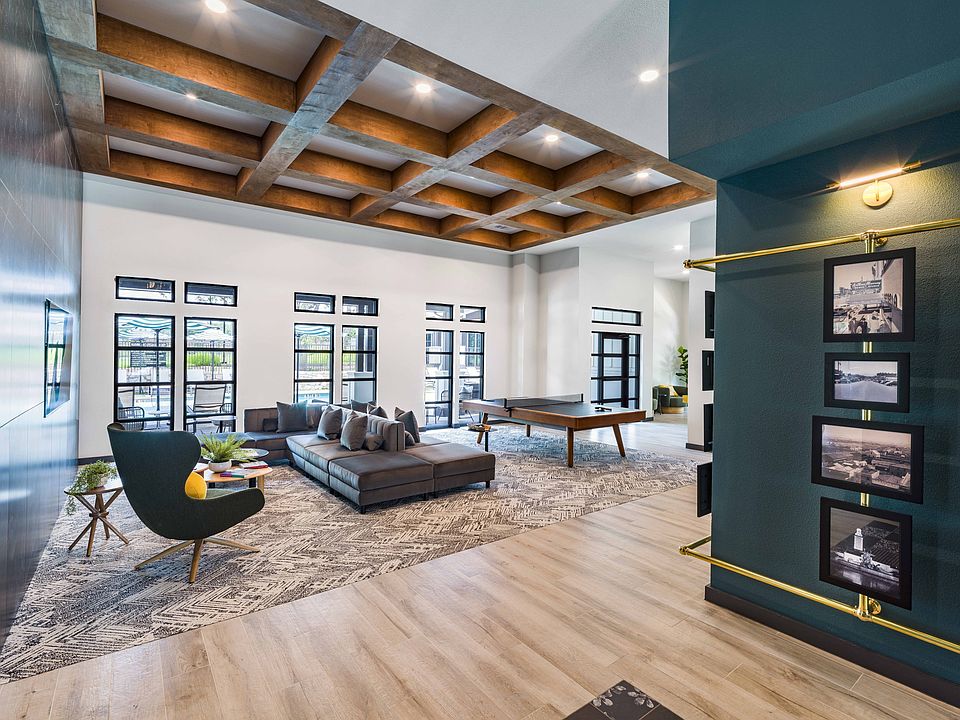 Unwind in style and unleash your competitive spirit at Modera Georgetown's game room, where excitement awaits with shuffleboard and ping pong tables.