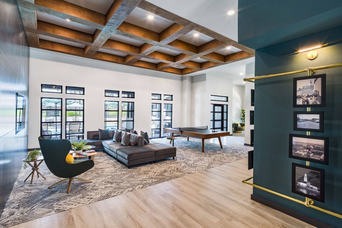 Unwind in style and unleash your competitive spirit at Modera Georgetown's game room, where excitement awaits with shuffleboard and ping pong tables.