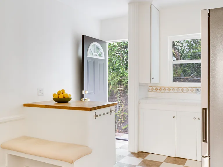 Kitchen offers dining nook for eating and working