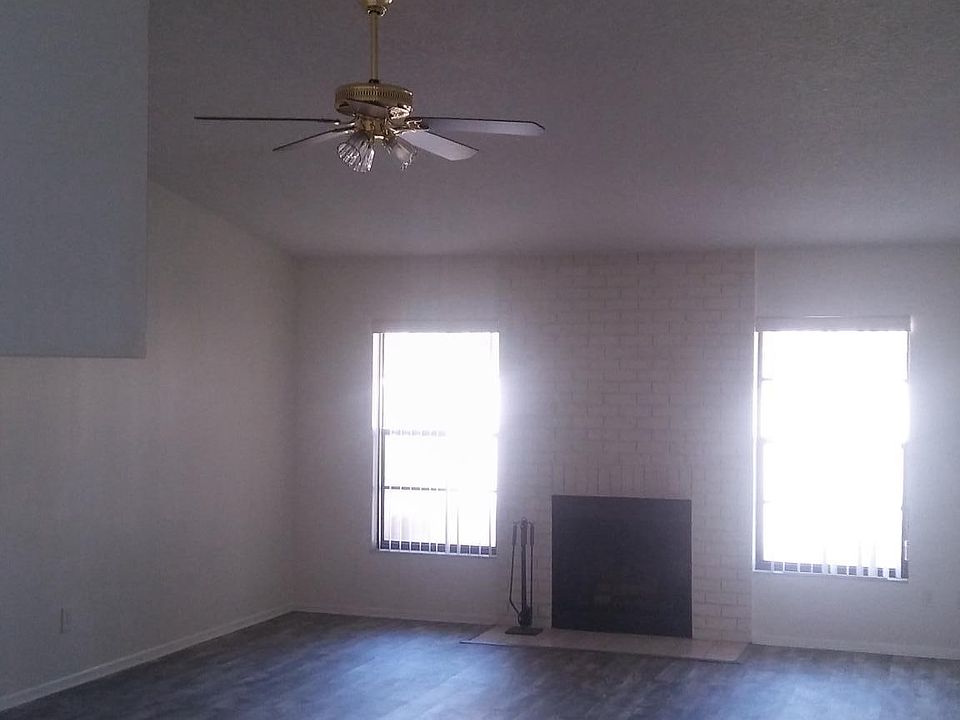 Great room w/ new vinyl floors and fireplace.